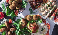 Mediterranean catering mezze platter with hummus, pita and grilled vegetables